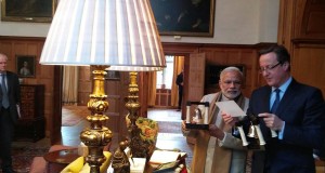 Modi gifts Cameron bookends with Gita verses on it